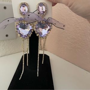 NWT Coquette Heart Shaped Crystal and Bowknot Tassel Drop Earrings in Purple.